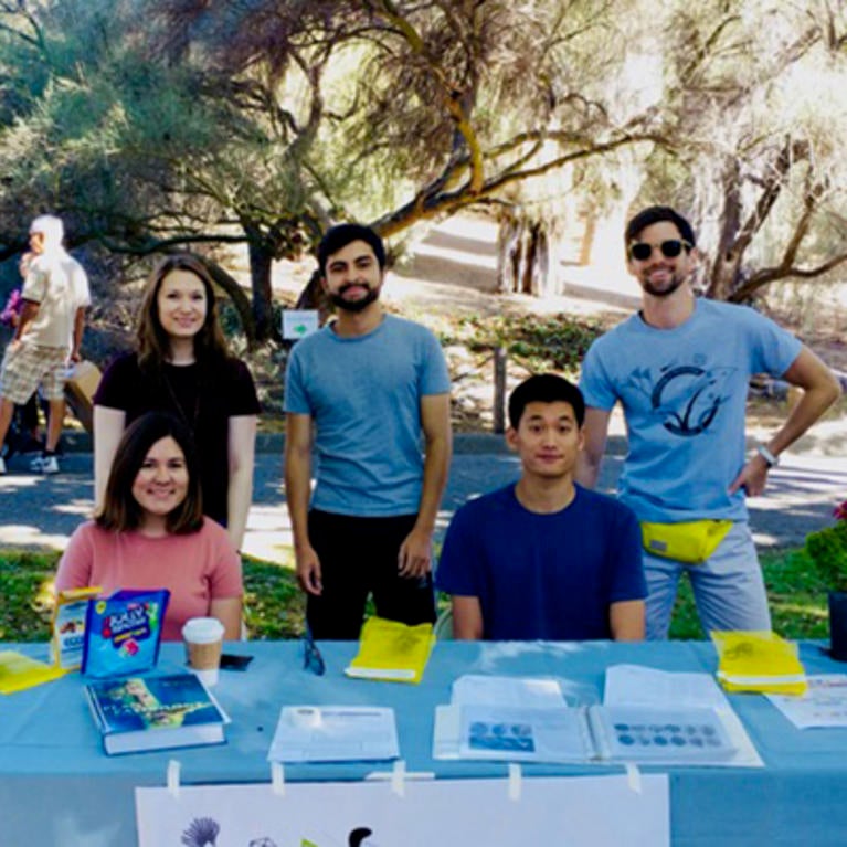students at table during Plant Pathology Outreach event (c) UCR