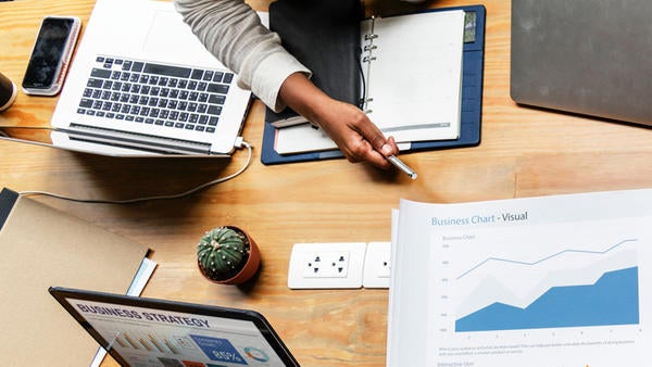 (c) rawpixel 983726 unsplash - business meeting laptops and charts