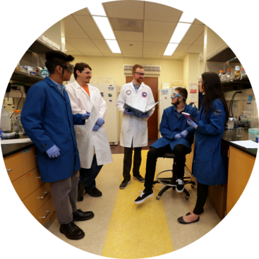 Adler Dillman in UCR nematology lab with students