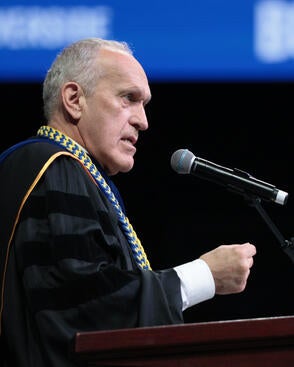 UCR Chancellor Kim Wilcox speaking at the 2025 UCR Commencement Ceremony
