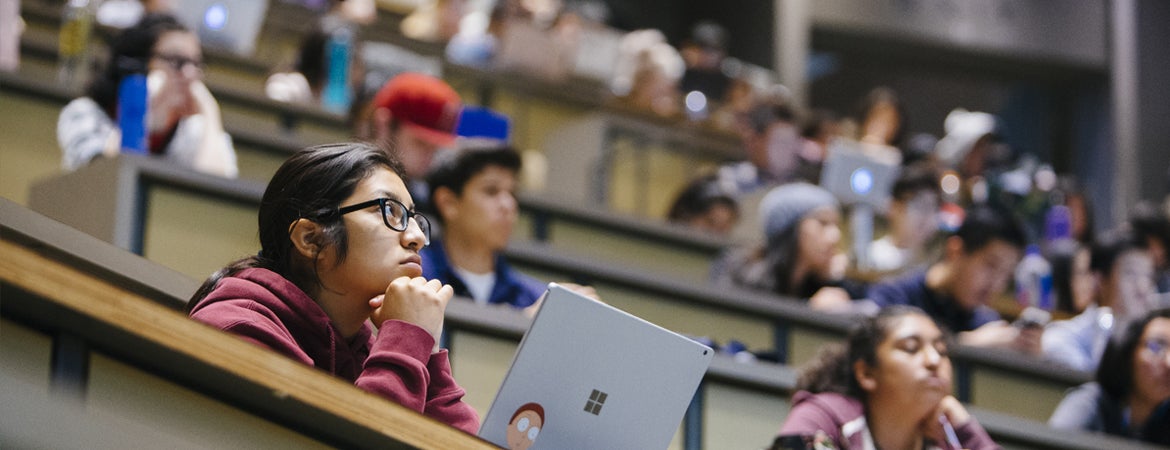 UCR students listen to a lecture in one of the campus' large lecture halls. 