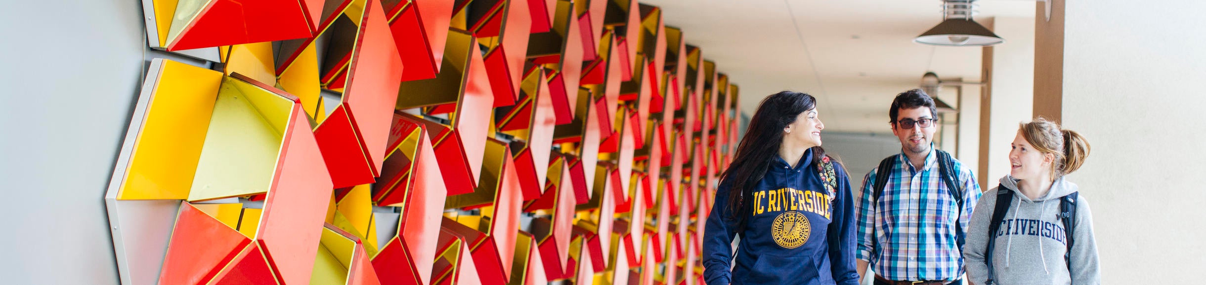 Students walking by Genomics