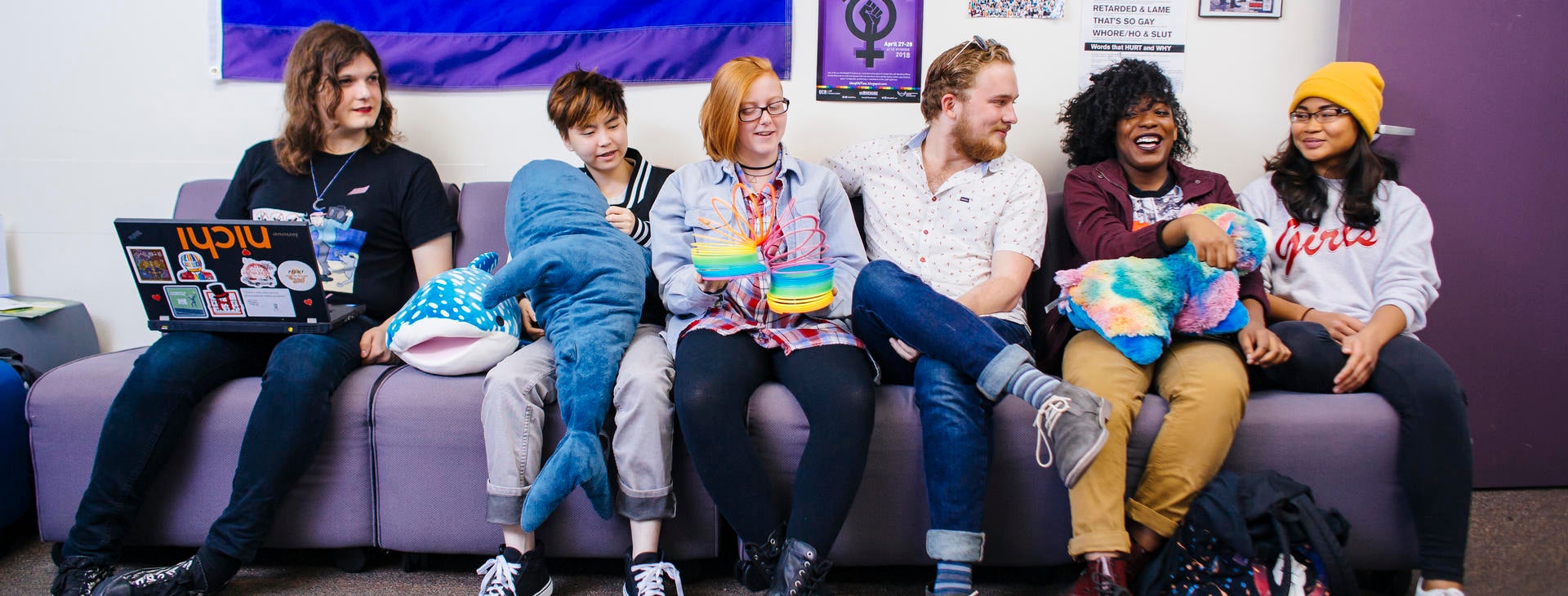 Six students sitting in the lounge area at the UCR LGBT Center