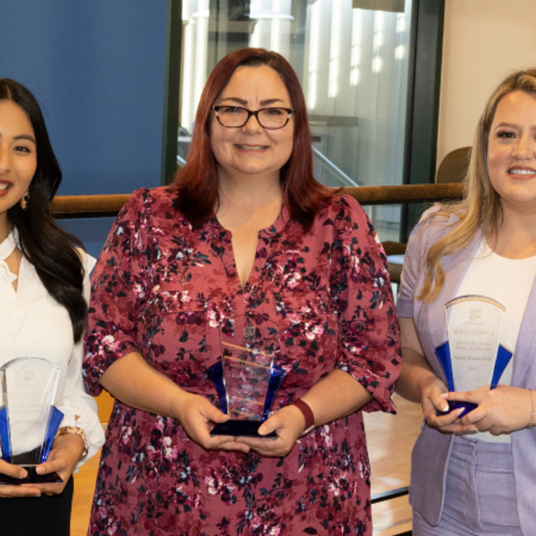 Alumni Award Recipients Lesly Monsalve, Rachael Bedolla, and Nallely Arteaga hold their awards