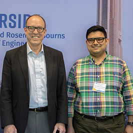 Photo of UCR Engineering Dean Chris Lynch posing for photo with Mohammadreza Barzegaran