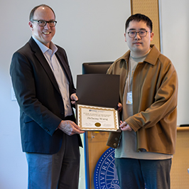 Photo of UCR Engineering Dean Chris Lynch posing for photo with Zichong Wang