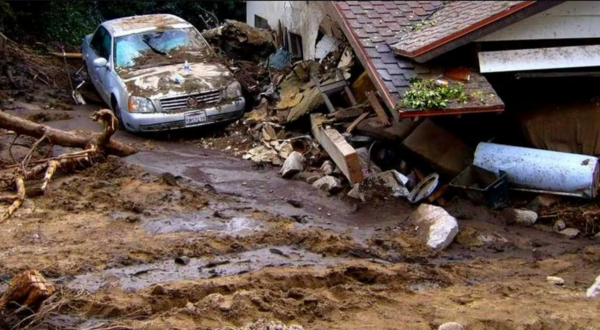 Debris from natural disaster, broken house and car.