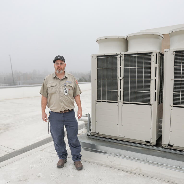 Mechanic on a rooftop