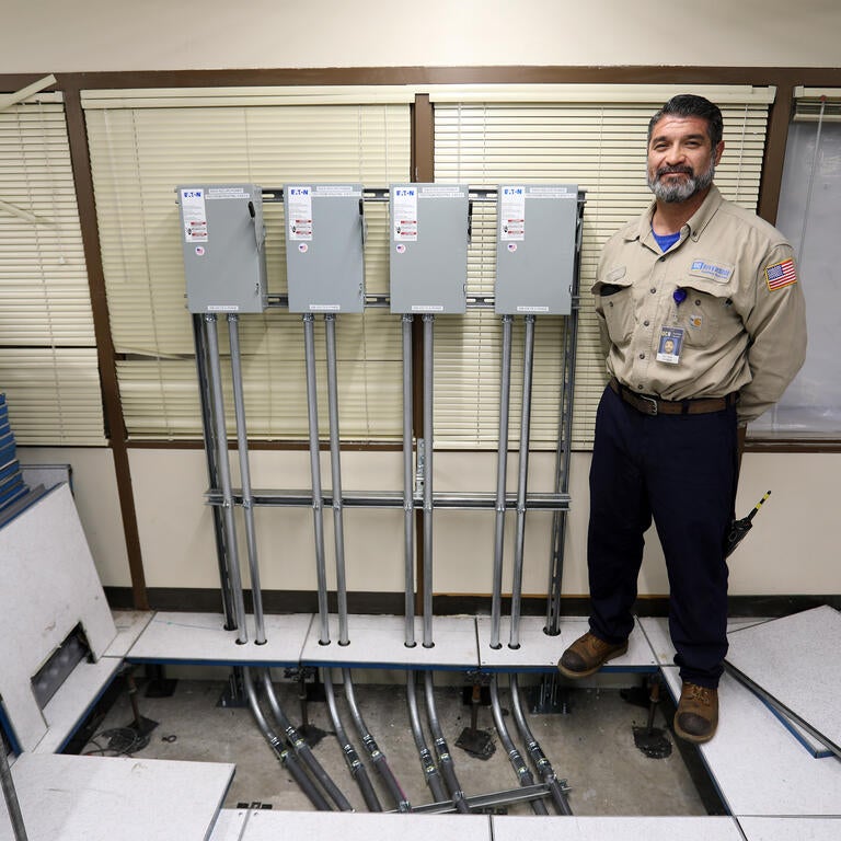 Electrician next to power source
