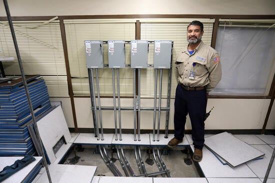 Electrician next to power source
