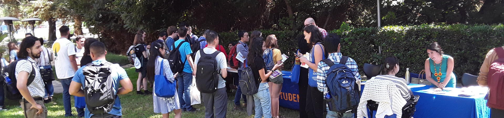 Students lined up at tables for resource fair