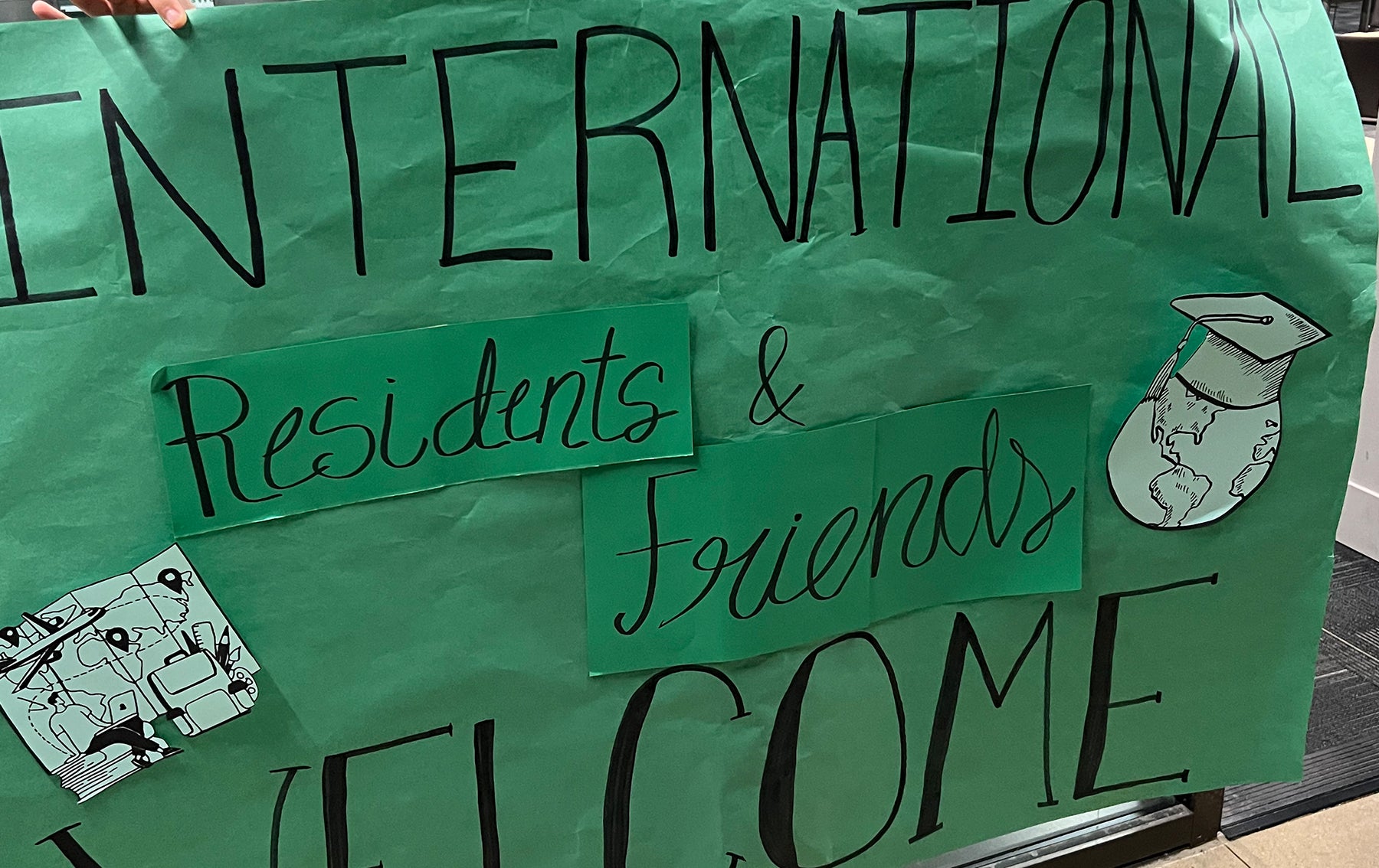 International Residents and Friends Welcome sign