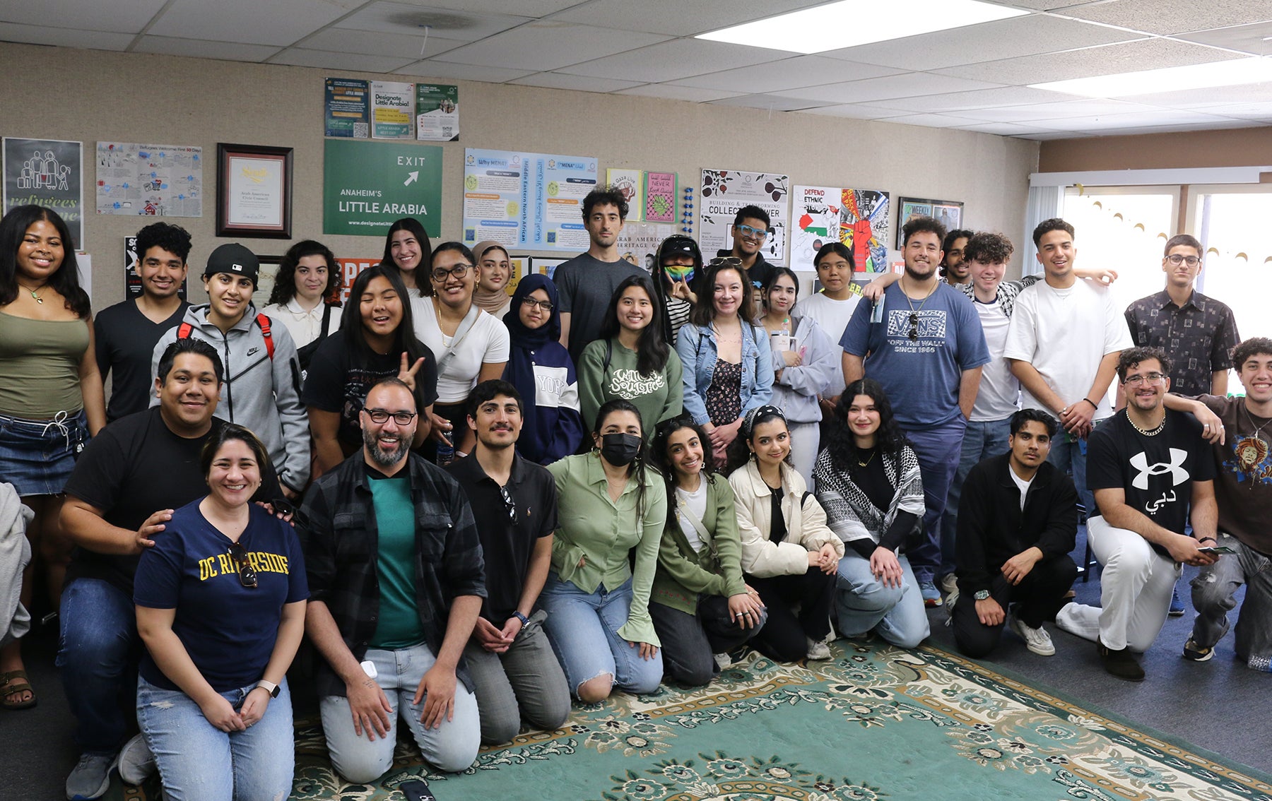 students in front of rug