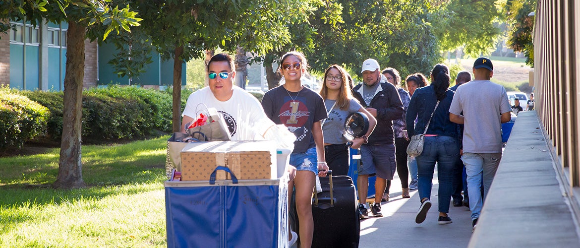 Students parents lined up with luggage