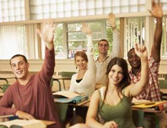 Students raising hands in class
