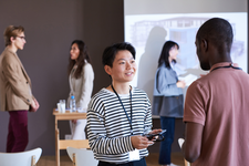 two men standing and talking