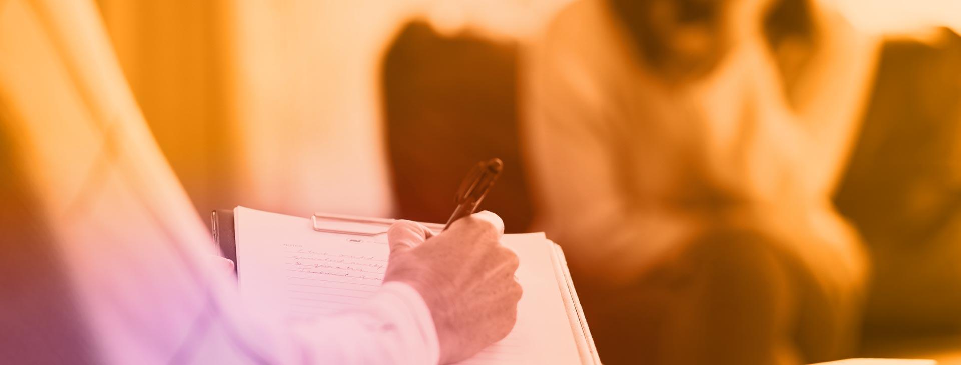 Duotone of student attending a counseling session.