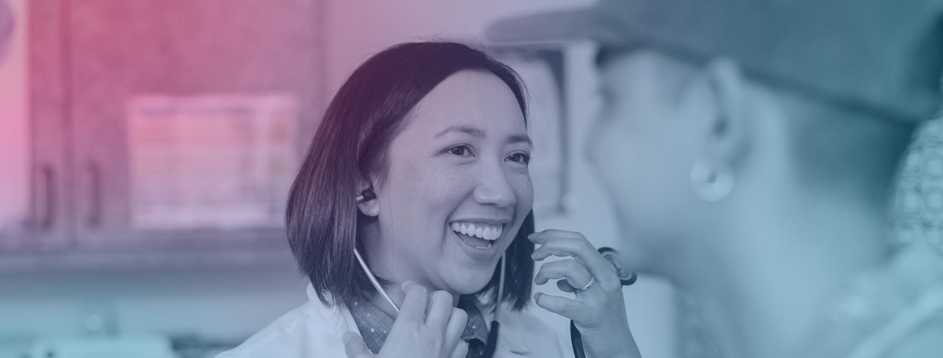 SHS Physician meets with a student during an appointment.