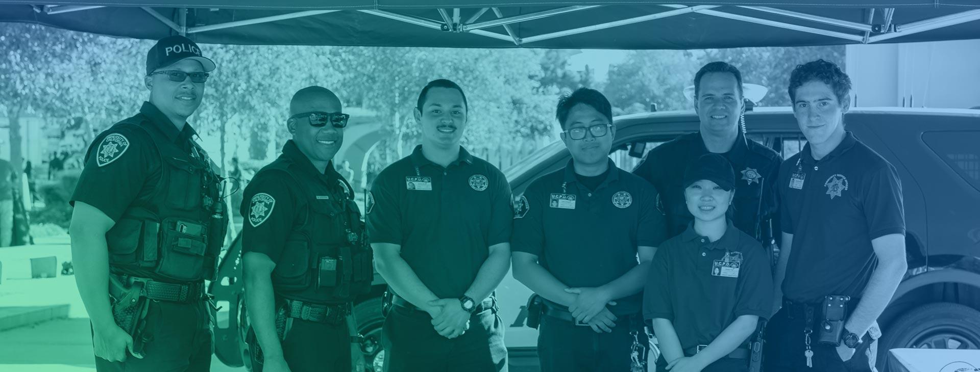Police & Campus Safety Officers tabling at a campus event.