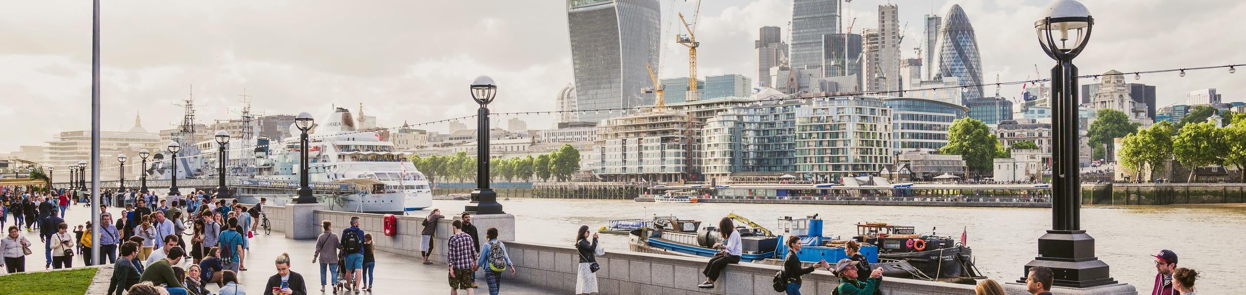 London Skyline, people walking near Thames River