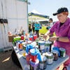Riverside muralist Ekaterina Orlovie prepares paint for volunteers on Tuesday, Oct. 3, 2023 at the R'Garden. (UCR/Stan Lim)