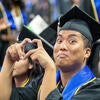 Graduate making finger heart