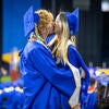 Graduates kissing