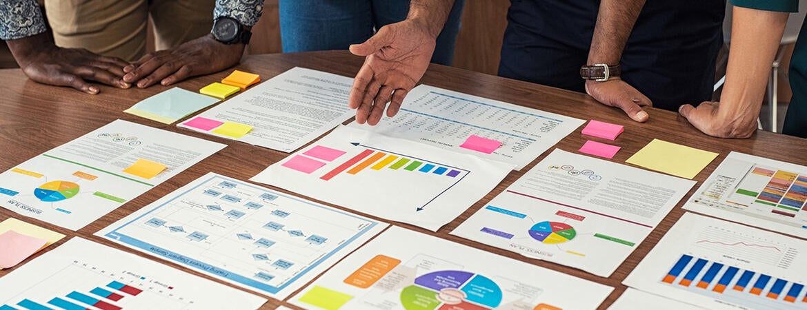 Officials examining graphs before decision making