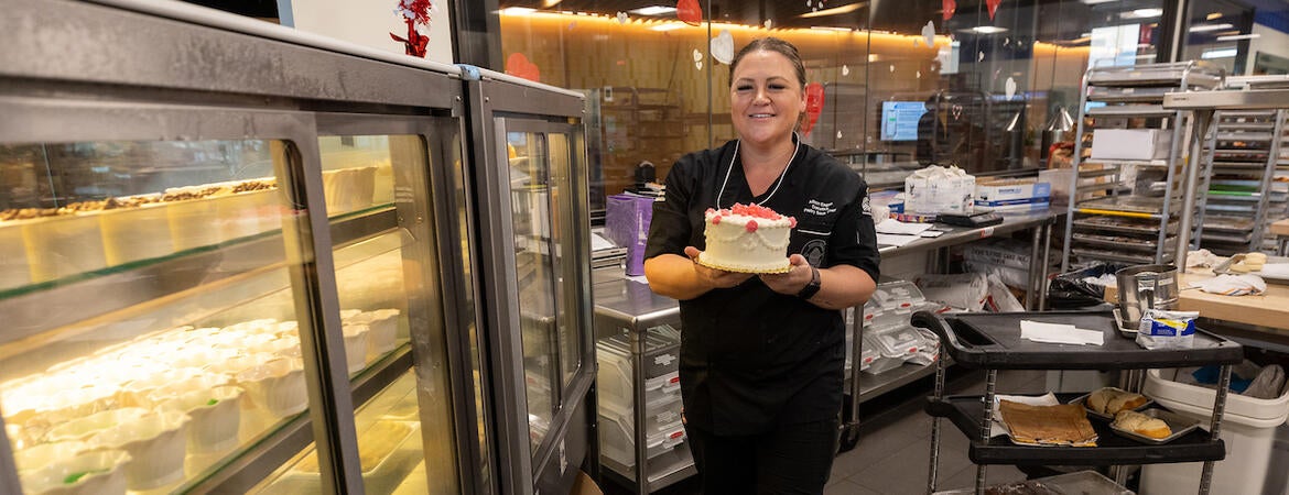 Allison Eagan holding a cake