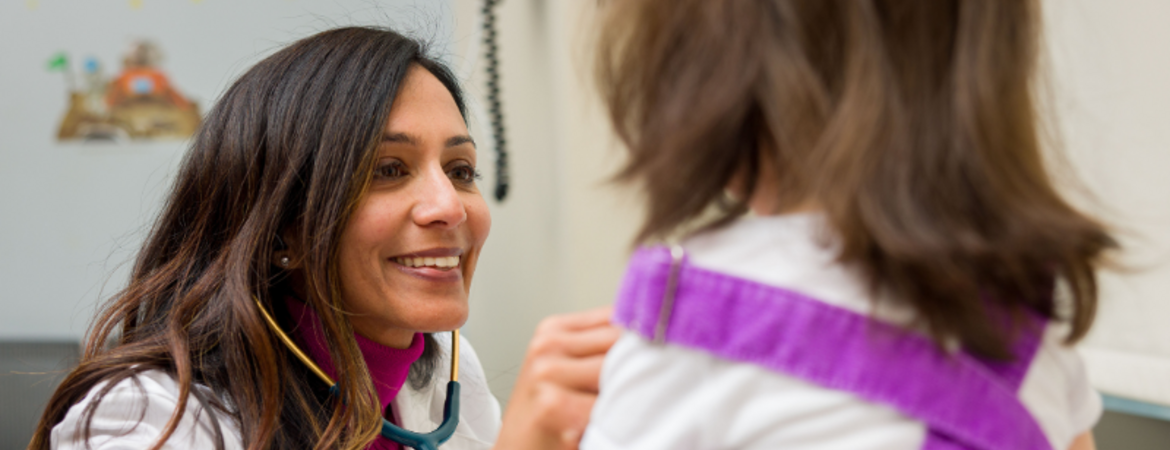 Pediatrician with patient