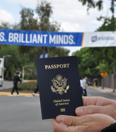 passport in front of UCR banner