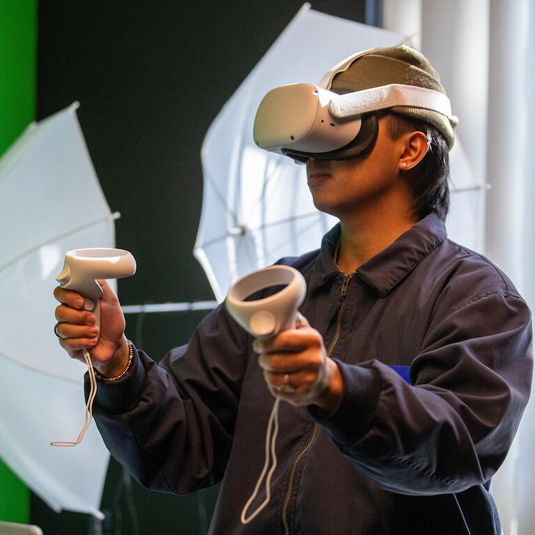 student in VR goggles