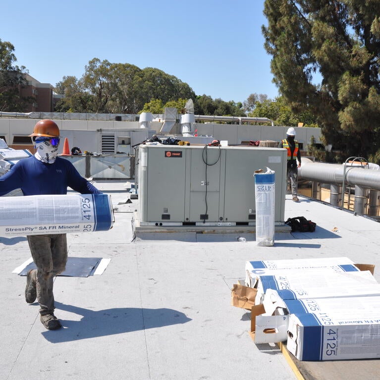 Crews working on Physics building roof