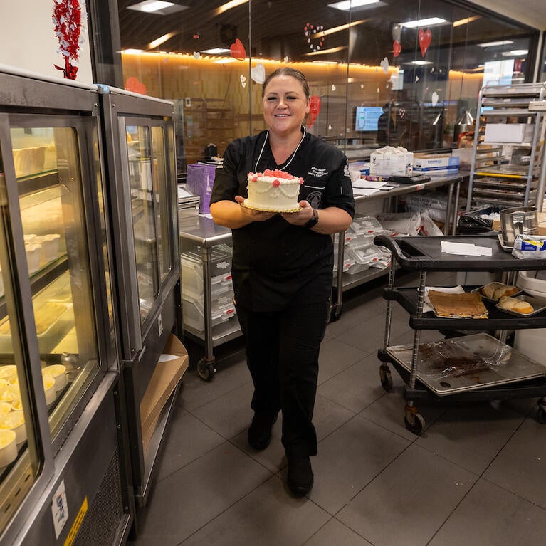 Allison Eagan holding a cake