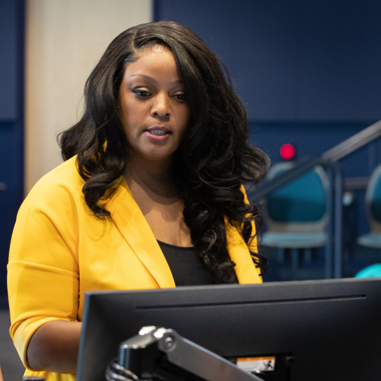 Woman touches screen with a serious look