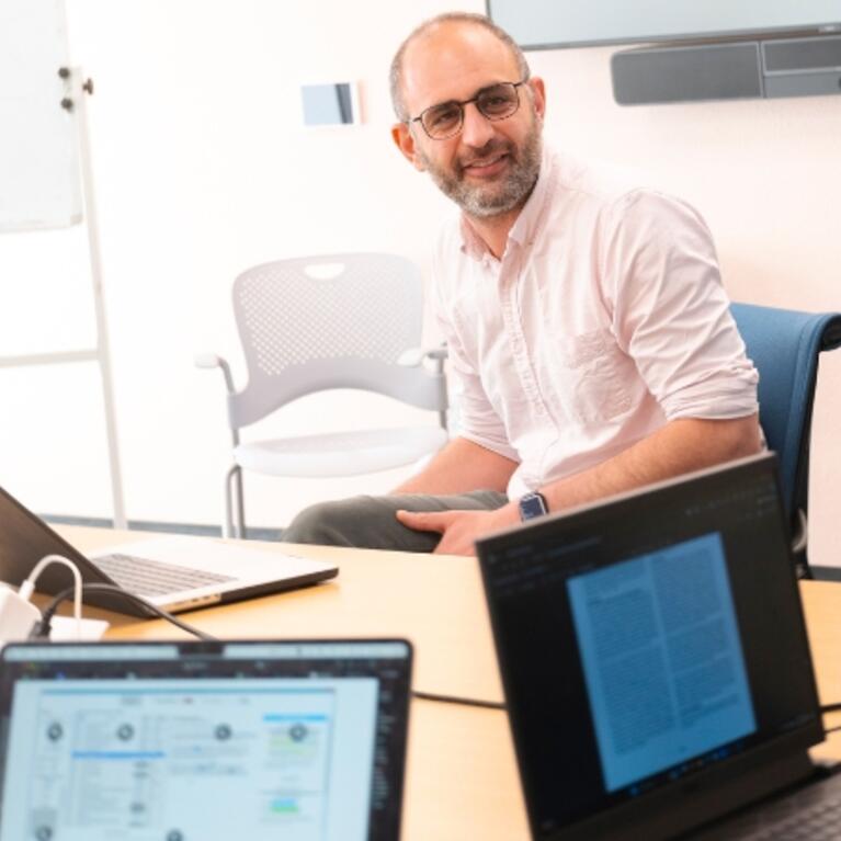 Image of a professor with students