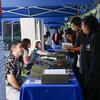 UCR Library staff chats to fair attendees. 