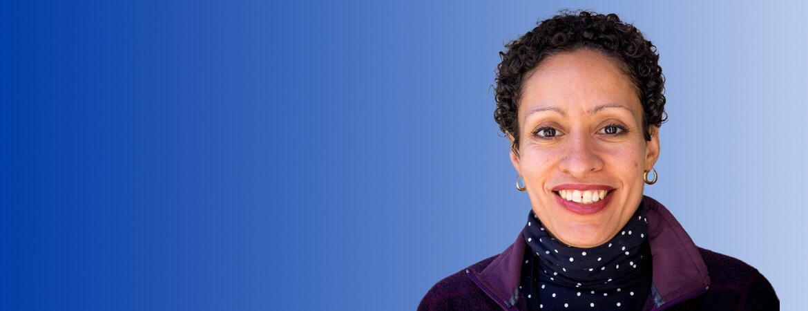 Lisa Fortuna in front of a blue background