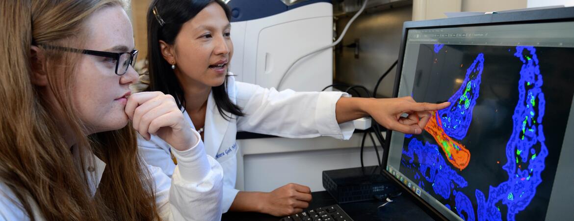 Dr. Nair with a student