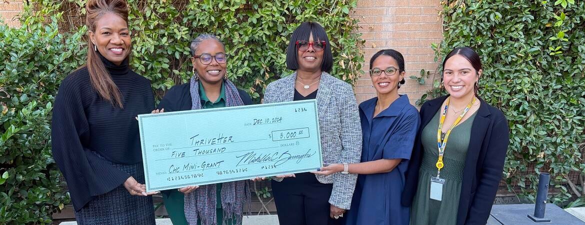 Winner of the Mini grant program being presented an oversized check