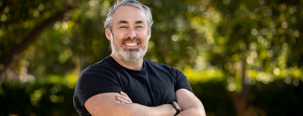 Brandon Brown in front of trees