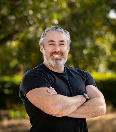 Brandon Brown in front of trees