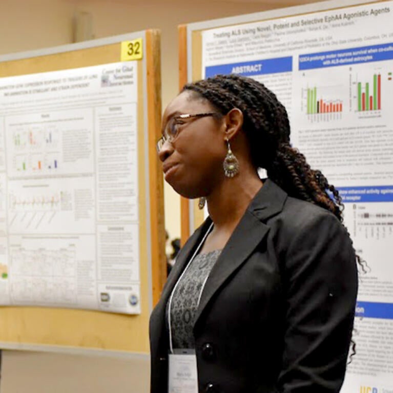 Two students chatting about research