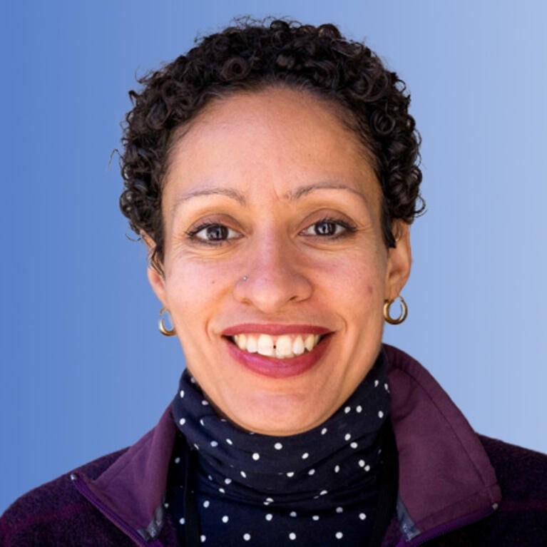 Lisa Fortuna in front of a blue background