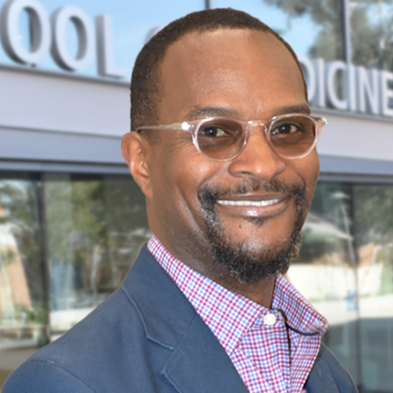 Dr. Mario Sims in front of the Ed Building 2