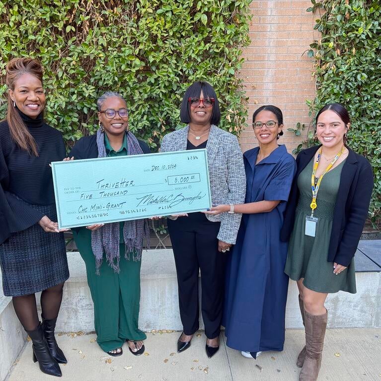 Winner of the Mini grant program being presented an oversized check