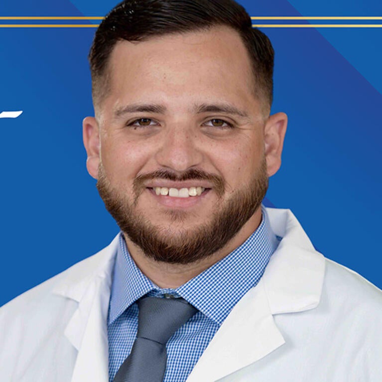 Paul Patlan in front of background