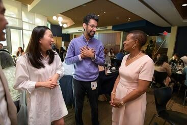 Deborah Deas, right, speaking to guests