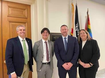 Pegan standing with Takano in DC