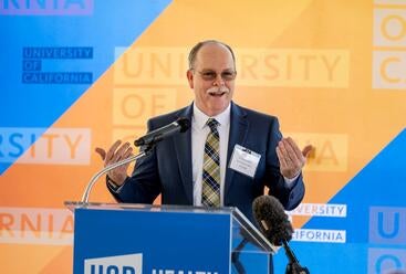 Tim Collins speaking at signing event